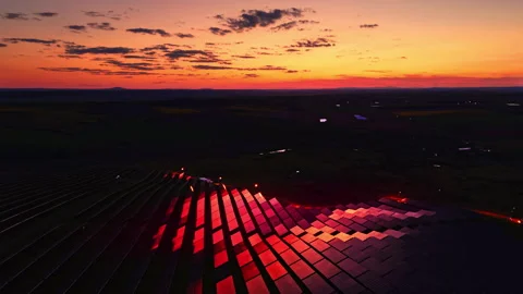 Crimson sunset glow on a solar module farm hill, Bulgaria Stock Footage 337198792