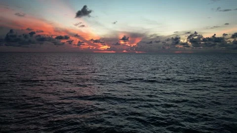 Crimson sunset on the sea with waves Stock Footage 305260700