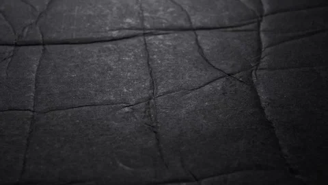 Crinkled Black Paper Texture and Folded Background Loop Stock Footage 341348843