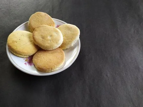 Crisp biscuits on a plate,Black background Stock Photos