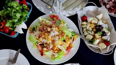 Crisp caesar salad featuring golden croutons, paired with artisan cheese Stock Footage 326144021