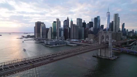 Crisp drone shot over Brooklyn Bridge at sunset. Lower Manhattan and Stock Footage 166020357