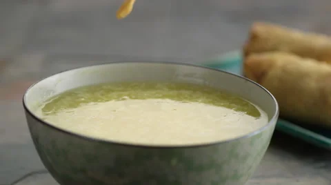 Crisp falling in soup in slow motion Stock Footage 46668337