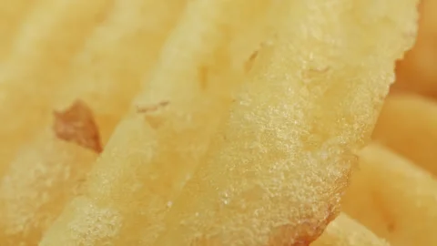 Crisp potato chip crinkle ridged cut macro close up presentation slowly rot.. Stock Footage 344694413