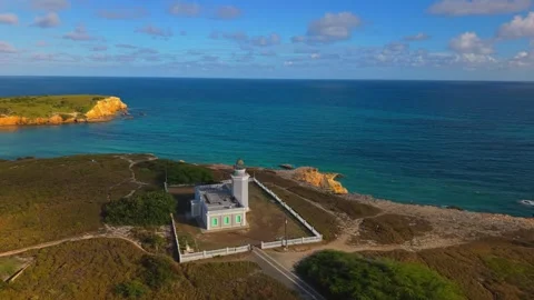 A crisp, top-down 4K drone shot of ocean surf rolling onto a pristine beach in Video stock 340832459