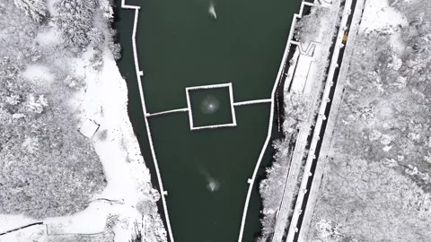 Crisp Top-Down Aerial Over a Snowy Reservoir After Fresh Snowfall in Korea Stock Footage 344247902
