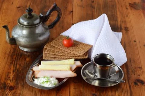 Crispbread, cheese, cottage cheese, ham, cherry tomato, coffee, sugar, cream Stock Photos