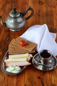 Crispbread, cheese, cottage cheese, ham, cherry tomato, coffee, sugar, cream Stock Photos