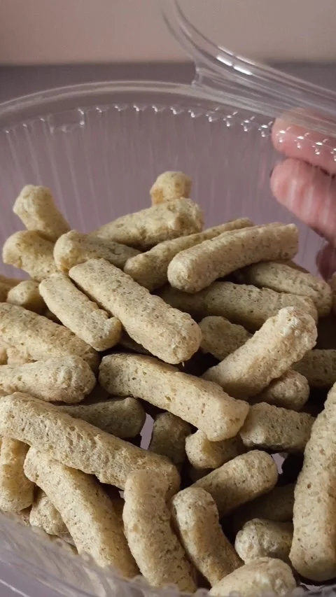 Crispbread in an open plastic container in a womans hand close-up. Healthy Stock Footage 324697623