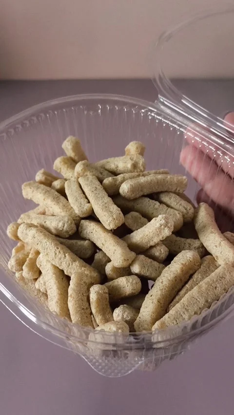 Crispbread in an open plastic container in a womans hand close-up. Healthy Stock Footage 324697774
