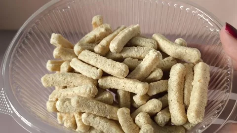 Crispbread in an open plastic container in a womans hand close-up. Healthy Stock Footage 324770008