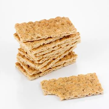 Crispbread, in a pile, one piece with a bite taken Foto stock