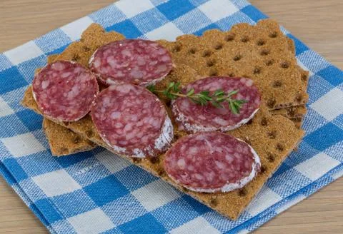 Crispbread with salami Stock Photos