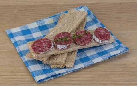 Crispbread with salami Stock Photos