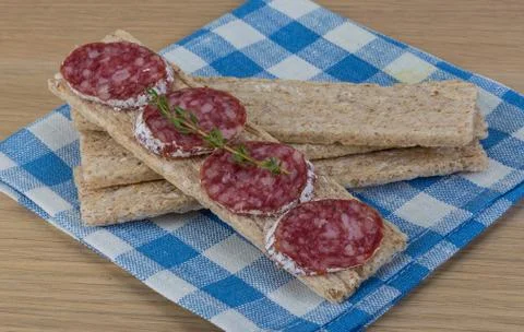 Crispbread with salami Stock Photos