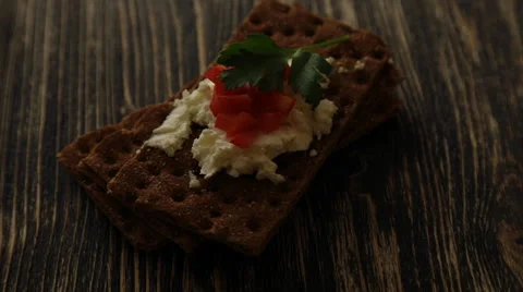 Crispbread with soft cottage cheese and red pepper Stock Footage 58816598