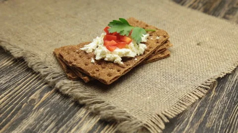 Crispbread with soft cottage cheese and red pepper Stock Footage 58817636