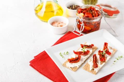 Crispbread with sun-dried tomatoes Stock Photos