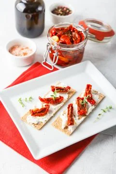 Crispbread with sun-dried tomatoes Stock Photos