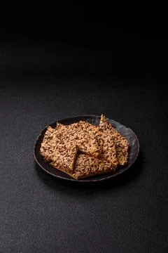 Crispbread, thin bread with seeds and grains, a baked cracker. Crispbread w.. Stock Photos