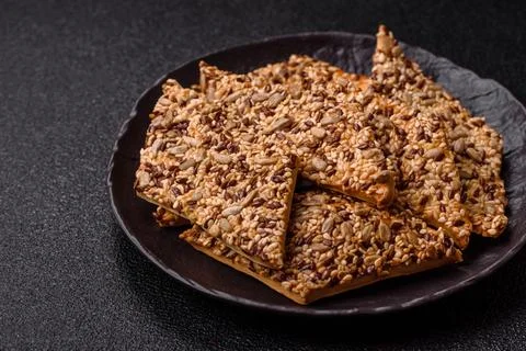 Crispbread, thin bread with seeds and grains, a baked cracker. Crispbread w.. Stock Photos