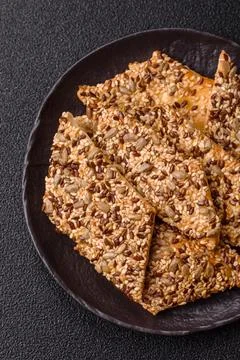 Crispbread, thin bread with seeds and grains, a baked cracker. Crispbread w.. Stock Photos