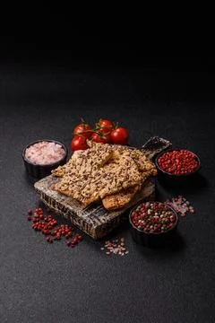 Crispbread, thin bread with seeds and grains, a baked cracker. Crispbread w.. Stock Photos