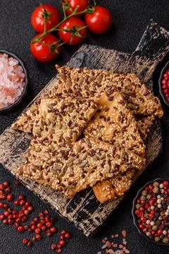 Crispbread, thin bread with seeds and grains, a baked cracker. Crispbread w.. Stock Photos