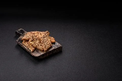 Crispbread, thin bread with seeds and grains, a baked cracker. Crispbread wit Stock Photos