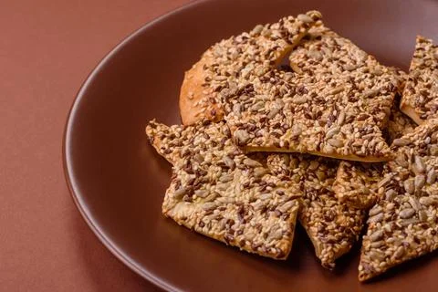 Crispbread, thin bread with seeds and grains, a baked cracker. Crispbread w.. Stock Photos