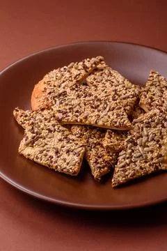Crispbread, thin bread with seeds and grains, a baked cracker. Crispbread w.. Stock Photos