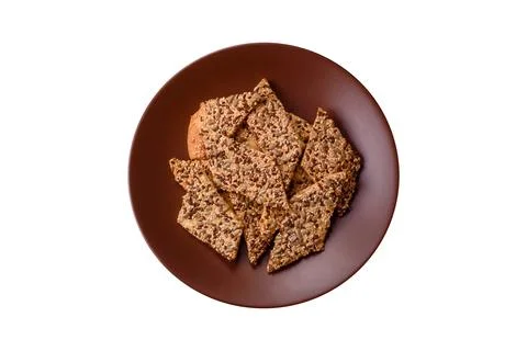 Crispbread, thin bread with seeds and grains, a baked cracker. Crispbread wit Stock Photos