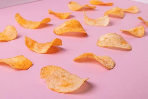 Crisps on pink Stock Photos