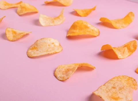 Crisps on pink Stock Photos