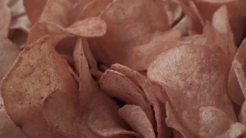 Crispy and flavored potato chips snack texture background top view Stock Footage 145783708