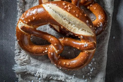 Crispy and hot pretzels as a snack for beer. Stock Photos