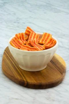 Crispy bacon flavored snack. Stock Photos