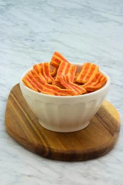 Crispy bacon flavored snack. Stock Photos