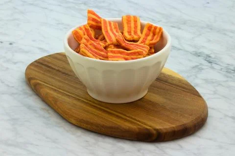Crispy bacon flavored snack. Stock Photos