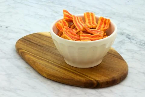Crispy bacon flavored snack. Stock Photos