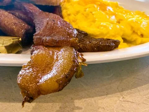 Crispy Bacon Strips with Scrambled Eggs Breakfast Close Up Stock Photos
