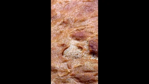 Crispy bread crust of freshly baked sourdough loaf, baking texture macro Video stock 321832452