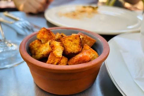 Crispy Bread Cubes in a Rustic Terracotta Bowl Stock Photos