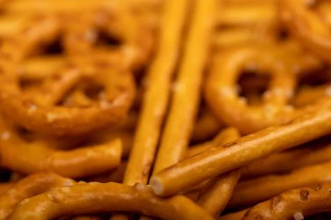 Crispy bread straws with salt, close-up, selective focus, top view. Stock Photos