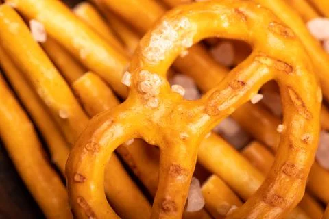 Crispy bread straws with salt, close-up, selective focus, top view. Stock Photos