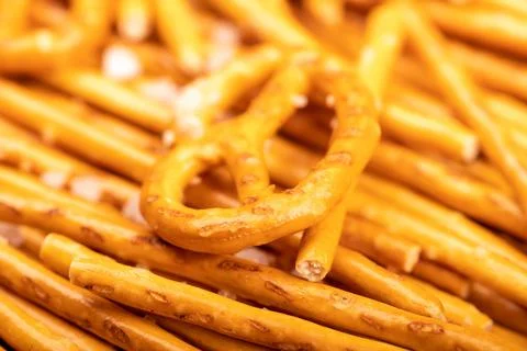 Crispy bread straws with salt, close-up, selective focus, top view. Stock Photos