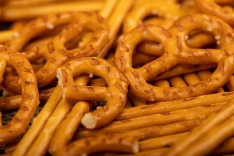 Crispy bread straws with salt, close-up, selective focus, top view. Stock Photos