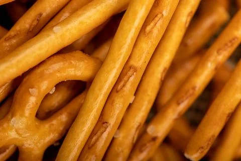 Crispy bread straws with salt, close-up, selective focus, top view. Stock Photos