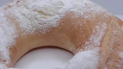 Crispy Bread On A White Plate On Turntable. Bread Is Sprinkled With Powdered Sug Stock Footage 203851188