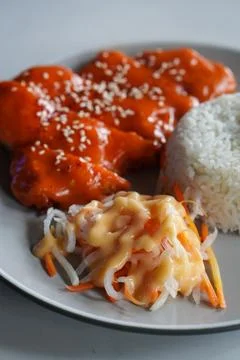 Crispy breaded chicken cutlet topped with creamy mentaiko sauce Stock-Fotos